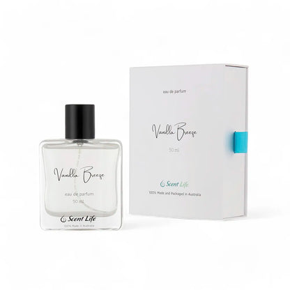 The sleek, clear glass bottle of Scent Life's Vanilla Breeze eau de parfum stands elegantly beside its stylish white box. Topped with a sophisticated black cap, this 50 ml bottle contains an exquisite fragrance that is proudly 100% made and packaged in Australia.