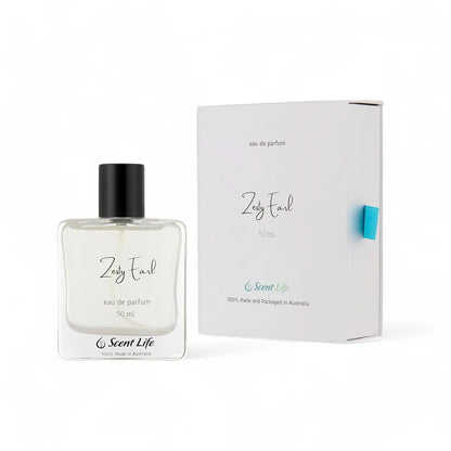 A clear glass bottle of Zesty Earl Eau de Parfum from Scent Life, 50 ml, featuring a black cap, is positioned next to a coordinating white box. Both the bottle and box showcase a minimalist design with black text that emphasizes citrusy notes. At the bottom, they both proudly display "100% Made and Packaged in Australia.