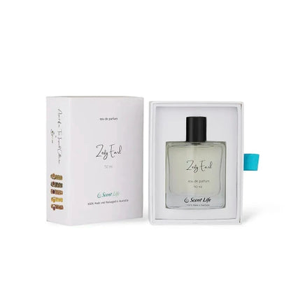 A 50 ml bottle of Zesty Earl Eau de Parfum from Scent Life is showcased in an open white box, emitting citrusy notes akin to Earl Grey tea. The minimalist bottle design featuring a black cap and a small, colorful side design is enhanced by green text declaring it as 100% handmade in Australia.
